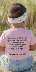 baby wearing soft pink Jeremiah 1:5 Christian tee
