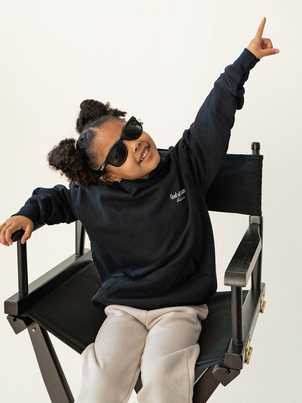Youth wearing a black Chosen & Set Apart Christian hoodie, reminding children they are chosen by God and set apart with purpose.