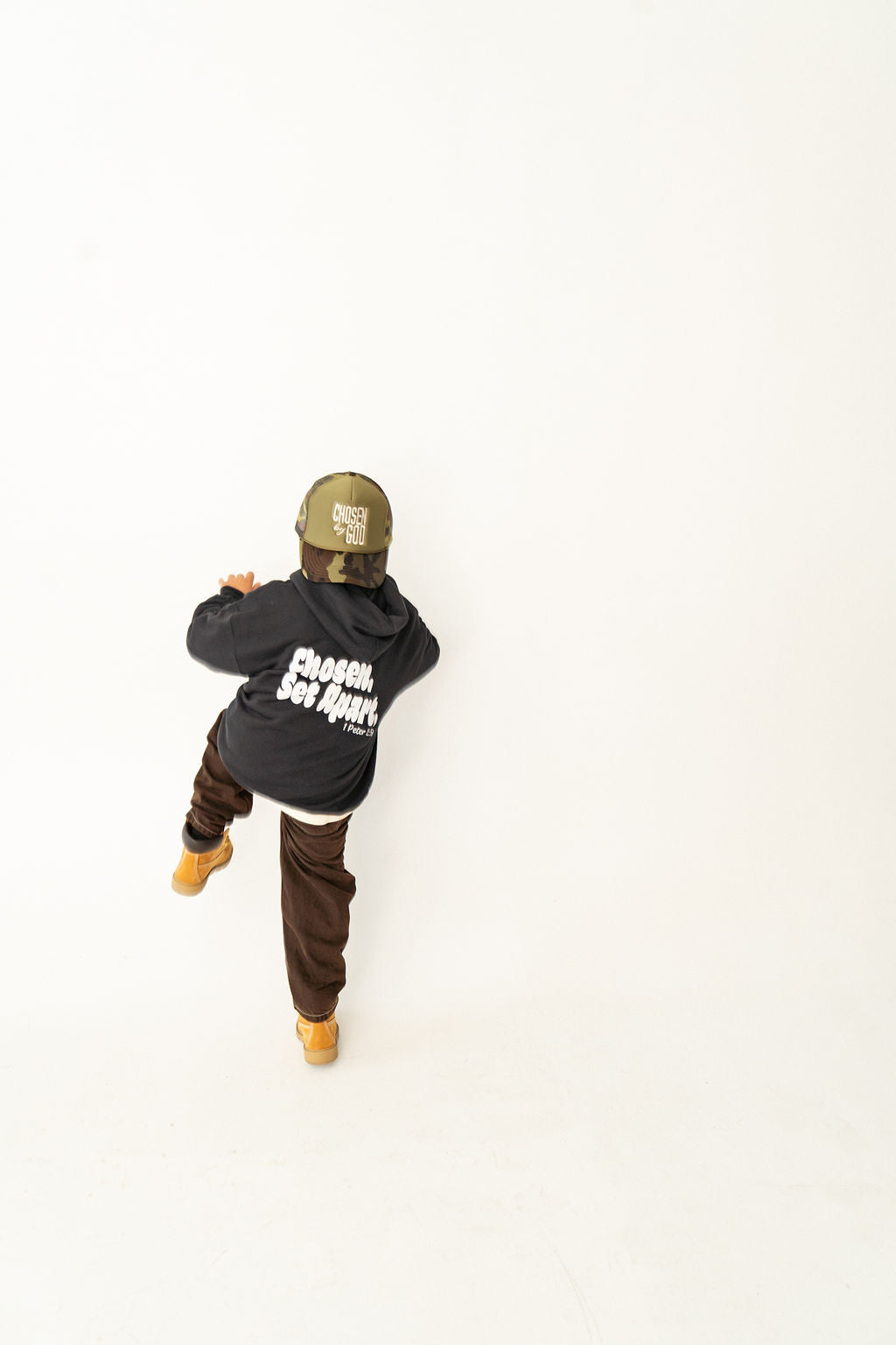 Youth wearing a black Chosen & Set Apart Christian hoodie, reminding children they are chosen by God and set apart with purpose.